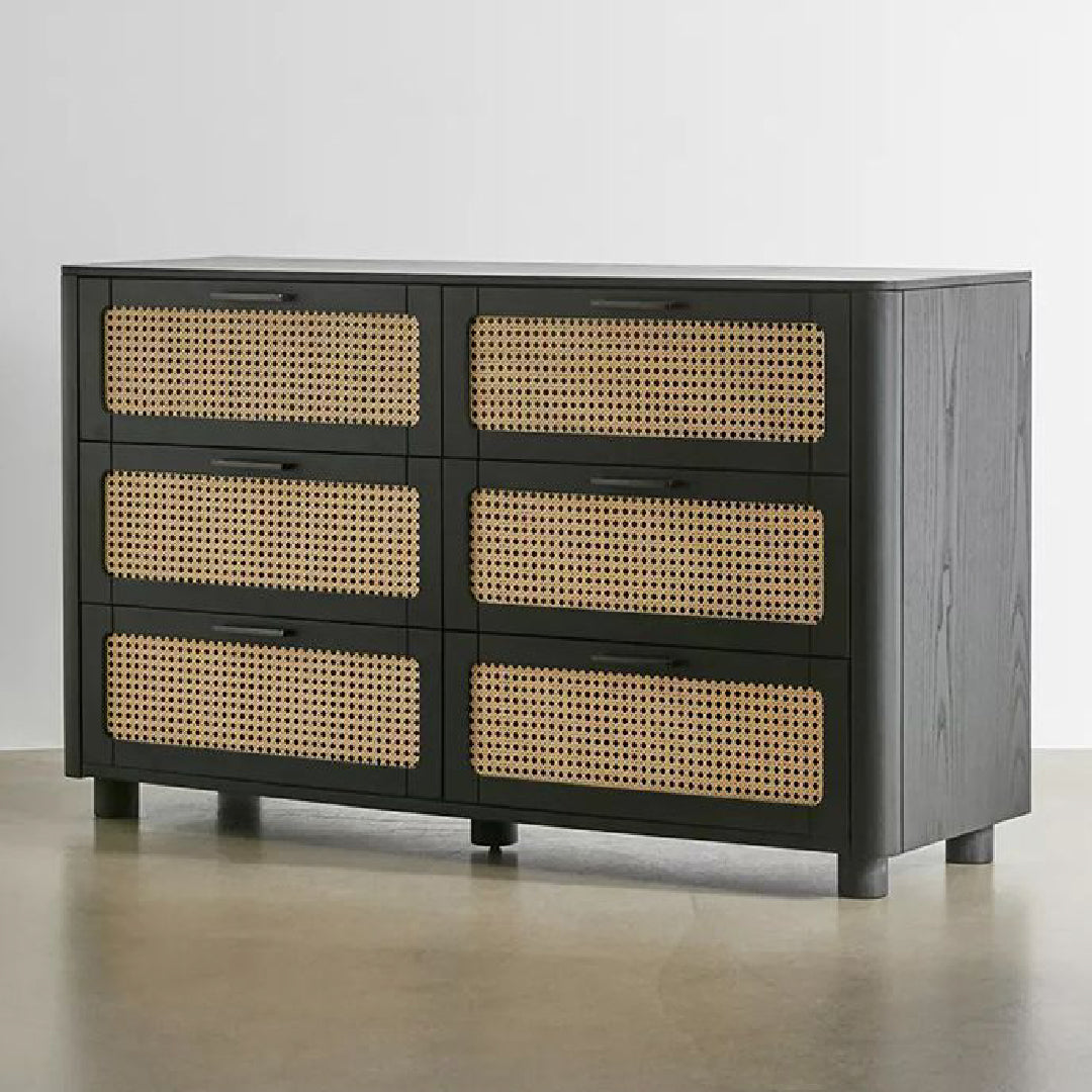 The Qienn Rattan Six Chest-of-Drawers with a black wood finish, combining modern design with natural rattan elements.