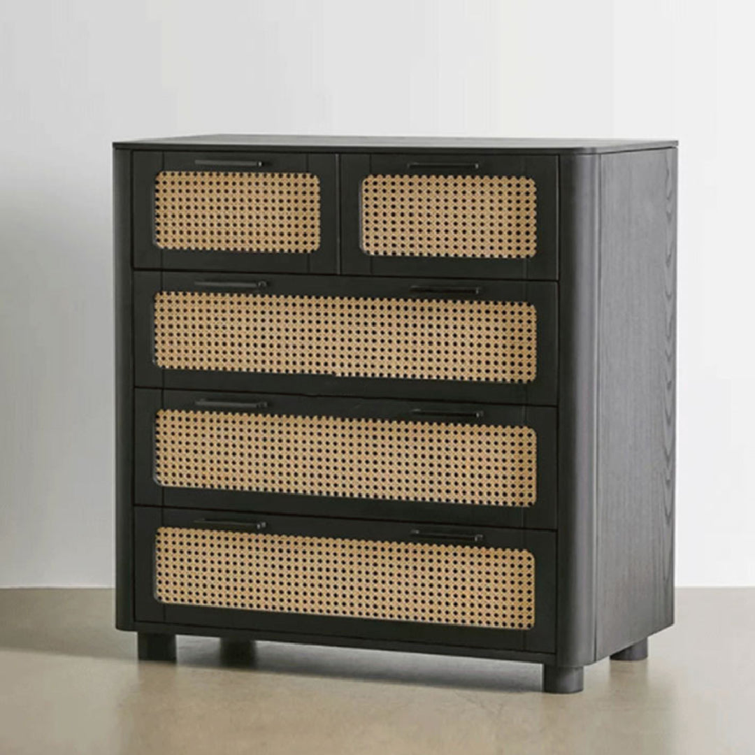 Side view of the Qienn Rattan chest in black, focusing on the textured wood finish and sturdy leg design.