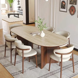 Mid-century modern dining set with Benenden Solid Ash Dining Chairs and oval travertine-top table – perfect for stylish UK homes and contemporary interiors.

