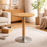Round wood-finish pedestal coffee table in a warm modern UK living room