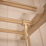 Close-up of a brass towel hanger's joint, showcasing its sturdy construction and polished finish.