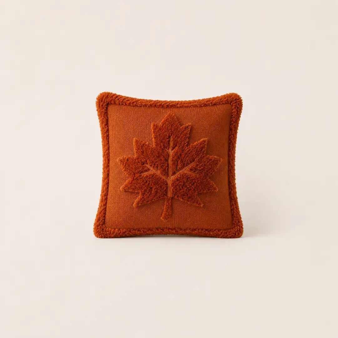 Burnt orange Halloween cushion with raised maple leaf design, ideal as a cushion for sofa or bedroom décor