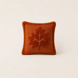 Burnt orange Halloween cushion with raised maple leaf design, ideal as a cushion for sofa or bedroom décor