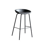 Hackney Industrial Leather Bar Stool in sleek black, featuring a minimalist design with sturdy metal legs and a comfortable curved seat.