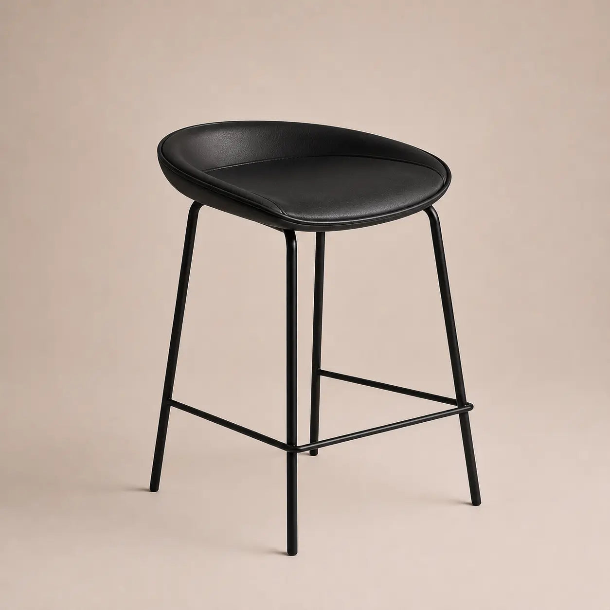 Black bar stool with a beige background