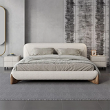 Full view of the Haven Bouclé Bed Frame in a contemporary bedroom setting, highlighting its sleek curves and plush boucle fabric.