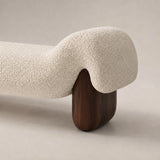 Haven cream boucle end of bed bench with curved upholstered design and rounded dark wood legs