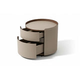 Handcrafted round beige designer bedside table UK with brass pull and stitched leather front