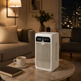 L11 portable mini air cooler fan on a coffee table in a cosy living room at night
