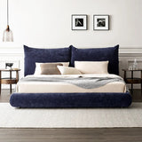 Chic navy blue upholstered bed frame with plush headboard and matching bedspread in an elegant, contemporary bedroom setting.