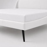 Luxury white upholstered super king bed frame with curved headboard and black metal legs for a modern UK bedroom