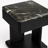 Maidstone luxury bedside table close-up showing polished green marble top with natural white veining.