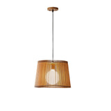 Minimalist maple wood barrel pendant light with warm lighting, hanging against a white background, highlighting its clean and contemporary design.