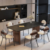 A modern kitchen dining area featuring the Meadow Industrial Rectangle Dining Table, paired with six stylish chairs, creating a perfect blend of industrial and contemporary design elements.