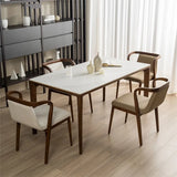 A contemporary dining room with a marble table and wooden Mid-Century Modern chairs with cushioned seats and backs, set against a backdrop of sheer curtains and minimalist decor.