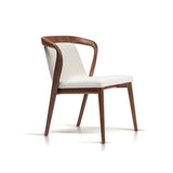 Modern walnut dining chair with white upholstery and a smooth curved backrest, standing on an isolated background, showcasing elegance and comfort.