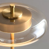 Close-up of the brass top and clear glass dome shade of the Mid-Century Walnut Wood & Brass Lamp, highlighting the smooth metallic finish and elegant craftsmanship