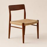 Studio front view of a rattan dining chair with solid wood frame, designed as a mid-century dining chair for modern and classic interiors.