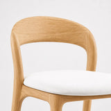 Mid-century bar stool with oak ash wood frame, curved backrest and white upholstered seat