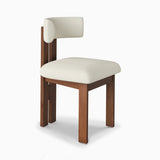 Mid-century Sunbury Dining Chair featuring a walnut wood frame and a cream upholstered seat with a curved backrest, highlighting its minimalist and timeless design ideal for modern interiors.