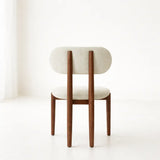 Chair with wooden frame and beige cushioned seat and backrest on a white background