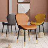 Three elegant dining chairs in different colours: grey, beige, and black, each with gold-tipped legs, arranged in a minimalist room with a neutral-toned interior.