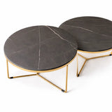 Round dark grey marble-effect nesting coffee tables with gold frame in a modern UK living room