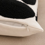 Close-up of the concealed zip closure and natural cotton fabric on the Polka Dot Tufted Cushion