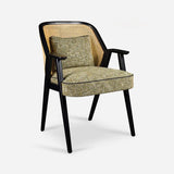 A Mid-Century style armchair featuring a rattan backrest, black wooden frame, and a cushioned seat with a textured green fabric. The chair combines vintage elegance with modern comfort, ideal for adding a retro touch to any space.