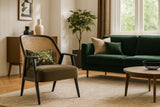 Modern living room with a green sofa, armchair, and coffee table.
