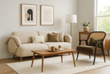 Living room with beige sofa, wooden coffee table, and armchair.
