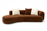 Brown sectional sofa with white and brown cushions on a white background