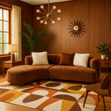 Modern living room with brown sectional sofa, decorative rug, and wall clock.