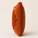 Close-up of burnt orange Halloween cushion with textured maple leaf and soft border for sofa or bedroom décor