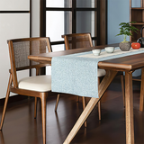 Angled side view of the Twickenham mid-century dining chair featuring a curved ash wood frame, woven back and cream upholstered seat