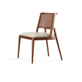 Twickenham mid-century dining chairs with woven backs and cream seats styled around a wooden dining table in a modern UK interior