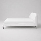 Front view of a white super king size bed frame with softly curved panelled headboard and black metal legs