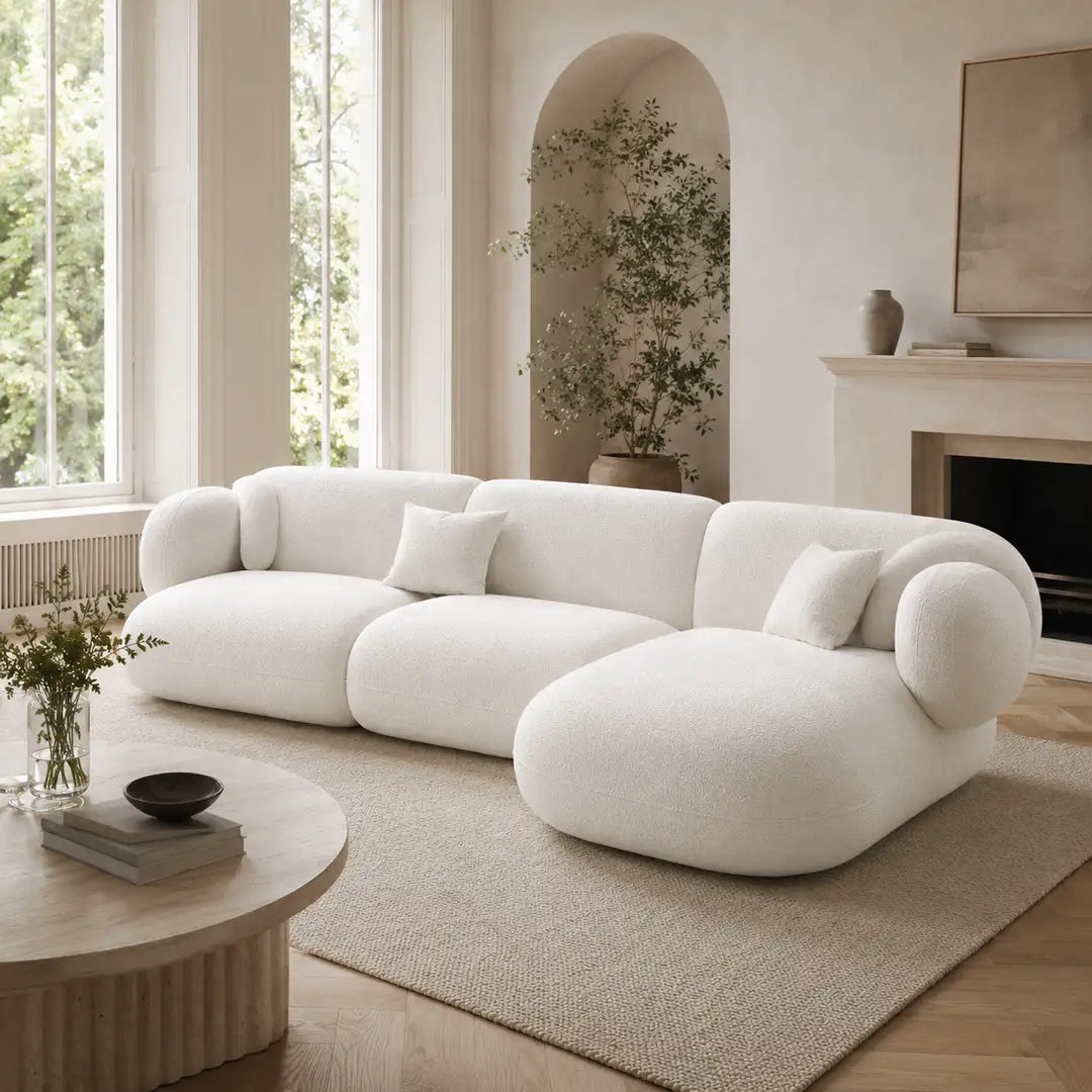 White Tofu Large L-shape Corner Sofa in a bright UK-style living room with tall windows, curved architectural alcove and soft neutral styling.