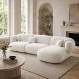 White Tofu Large L-shape Corner Sofa in a bright UK-style living room with tall windows, curved architectural alcove and soft neutral styling.