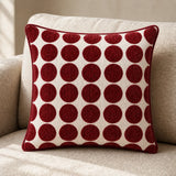Burgundy polka dot cotton velvet and linen cushion on a neutral sofa, 45 x 45 cm