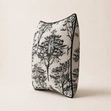 Side profile of the Woodland Cushion showing its filled shape and black piping