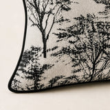 Close-up of the Woodland Cushion woven fabric, woodland print and black piping