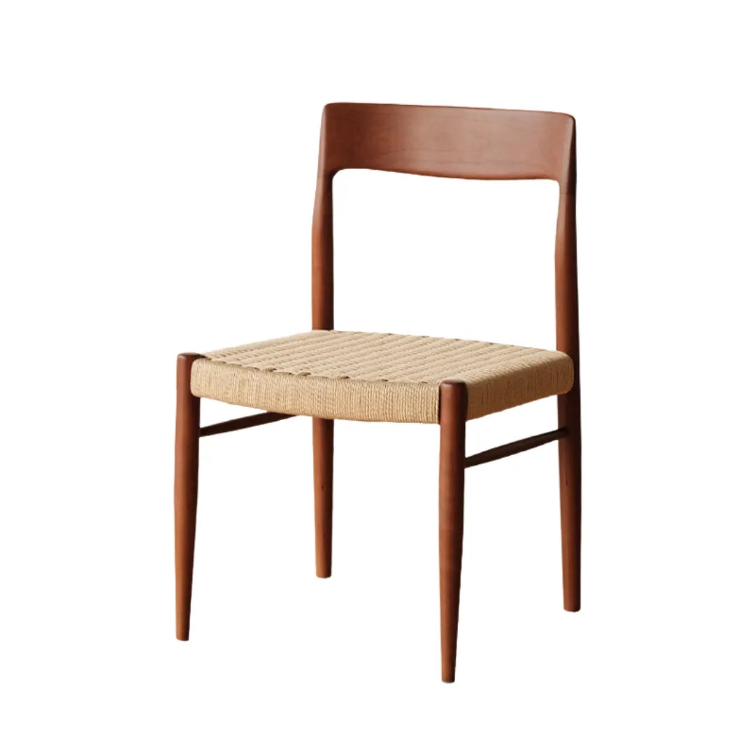 showcasing its sleek wooden frame and natural rattan seat, designed for stylish and comfortable dining.